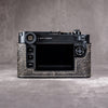 The back of a Leica M11 in the Buffalo SlimCase, screen clear of the leather