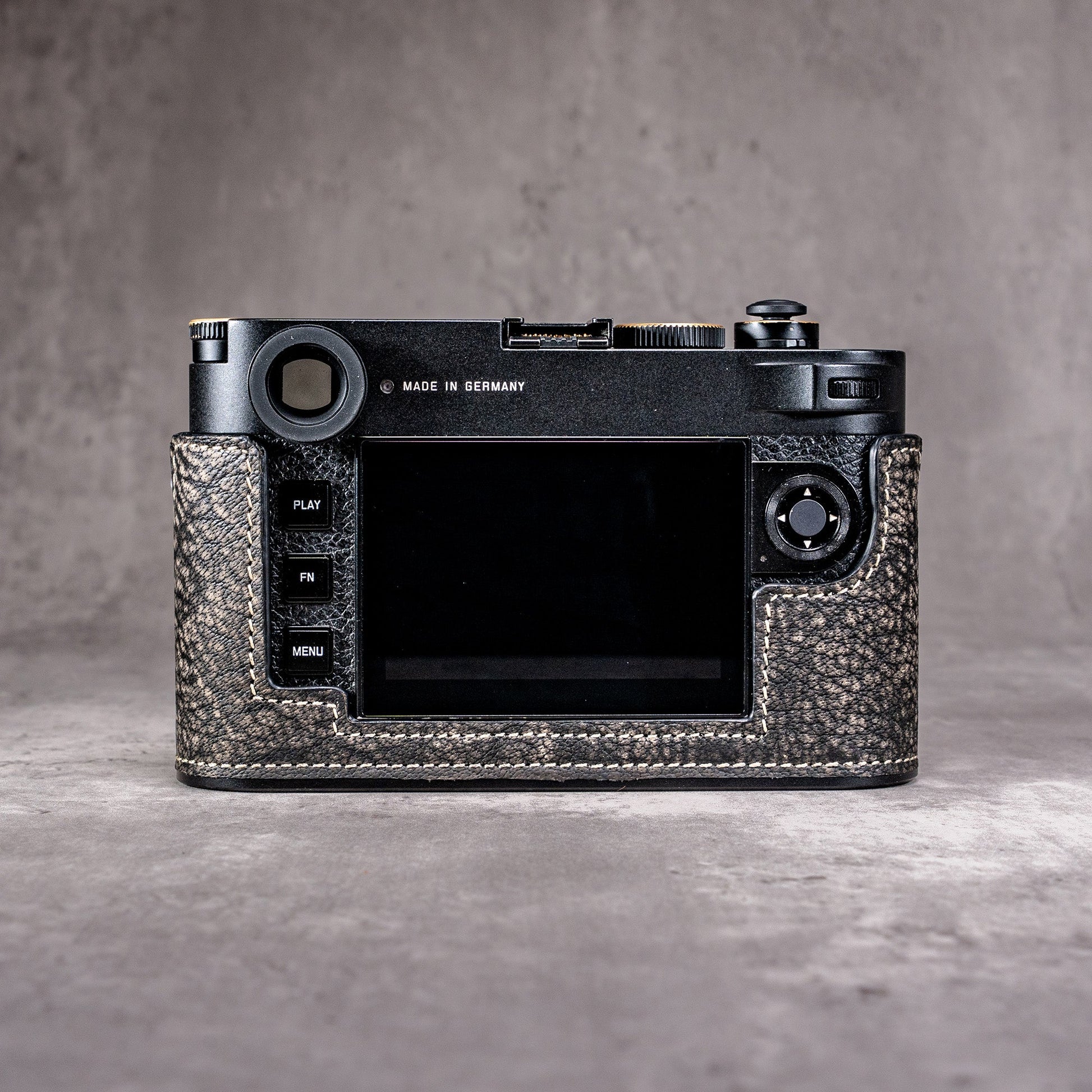 The back of a Leica M11 in the Buffalo SlimCase, screen clear of the leather
