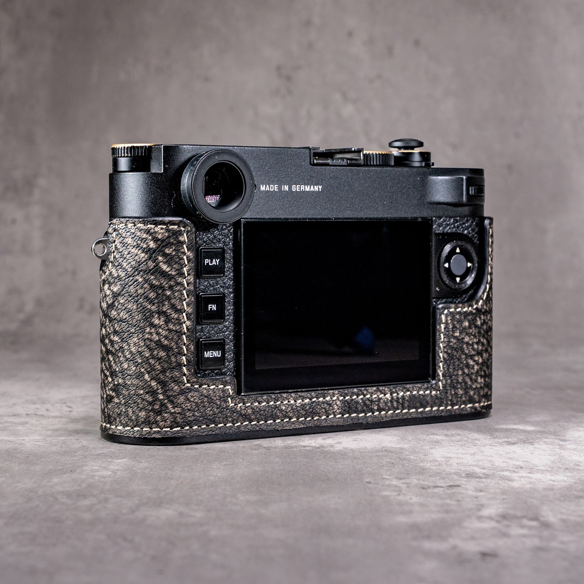 The back of the camera at an angle, showing the controls left uncovered