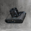 A black Leica in the Buffalo SlimCase from below, base door open