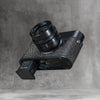 The battery coming out of a Leica in the Buffalo SlimCase without taking the case off