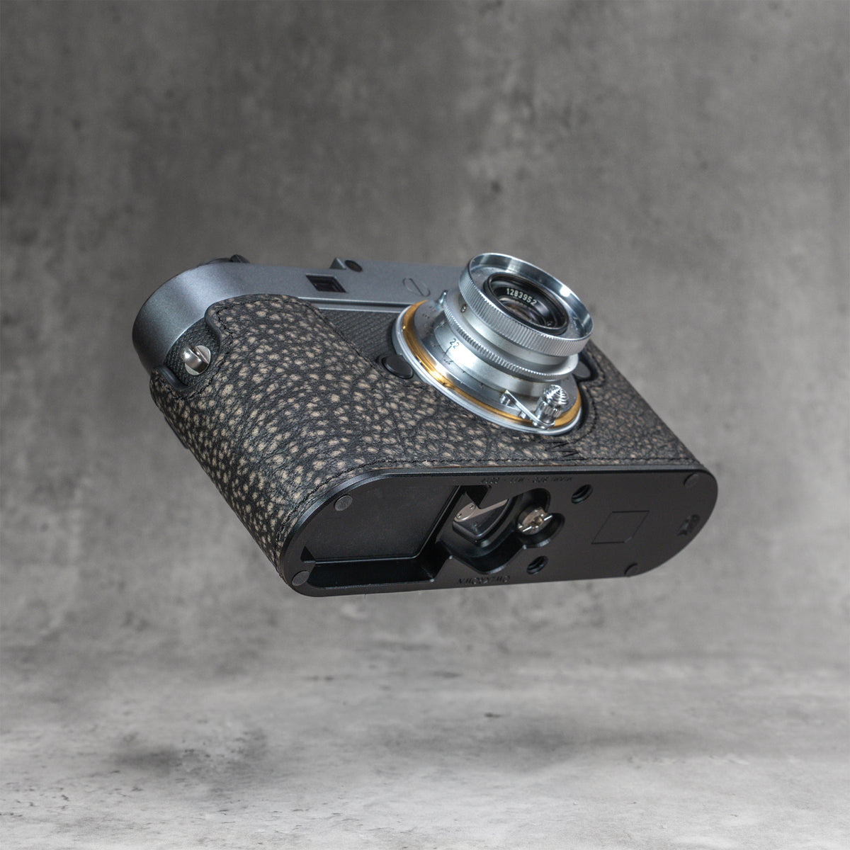 The underside of a Leica M11 in the Buffalo SlimCase, showing the opening in the base