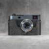 A Leica M11 in the Buffalo SlimCase photographed straight on from the front