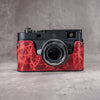 A Leica M11 in the Hot Lava SlimCase seen straight on from the front