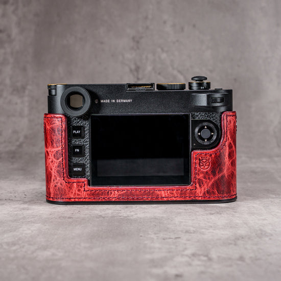 The back of a Leica M11 in the Hot Lava SlimCase, controls left clear of the leather
