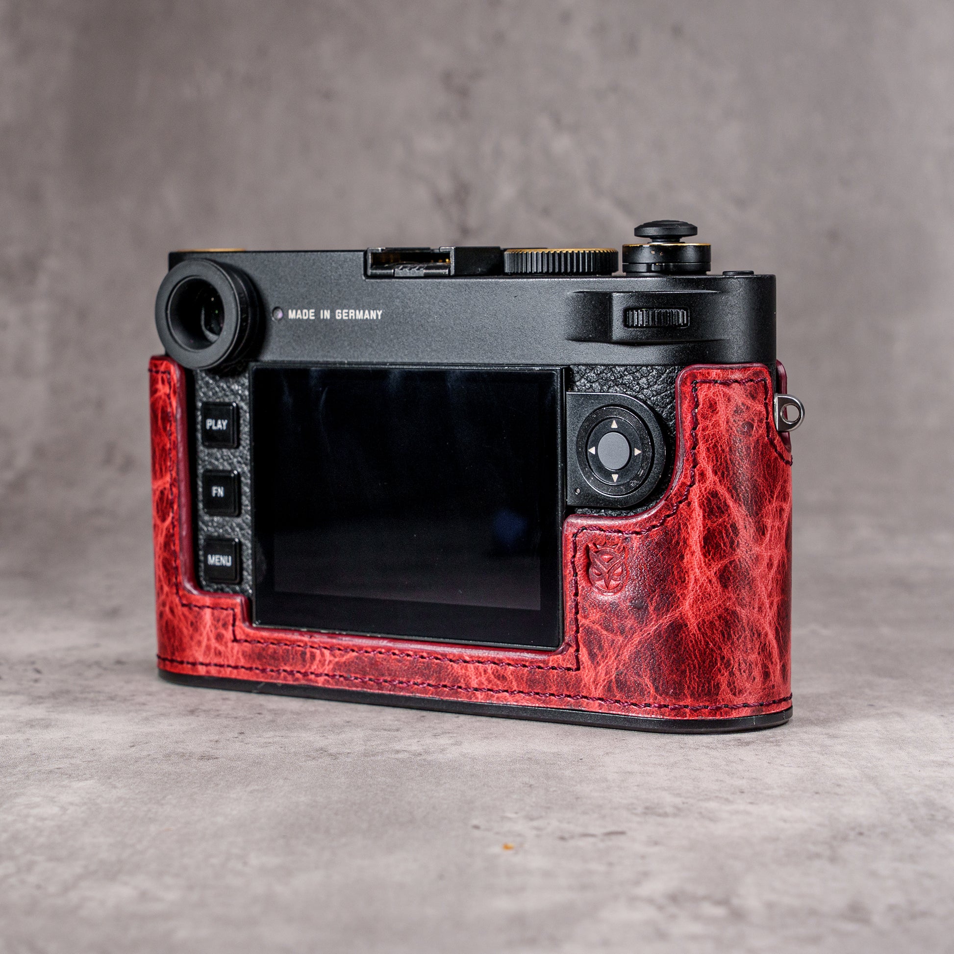 The back of a Leica M11 at an angle in the Hot Lava SlimCase