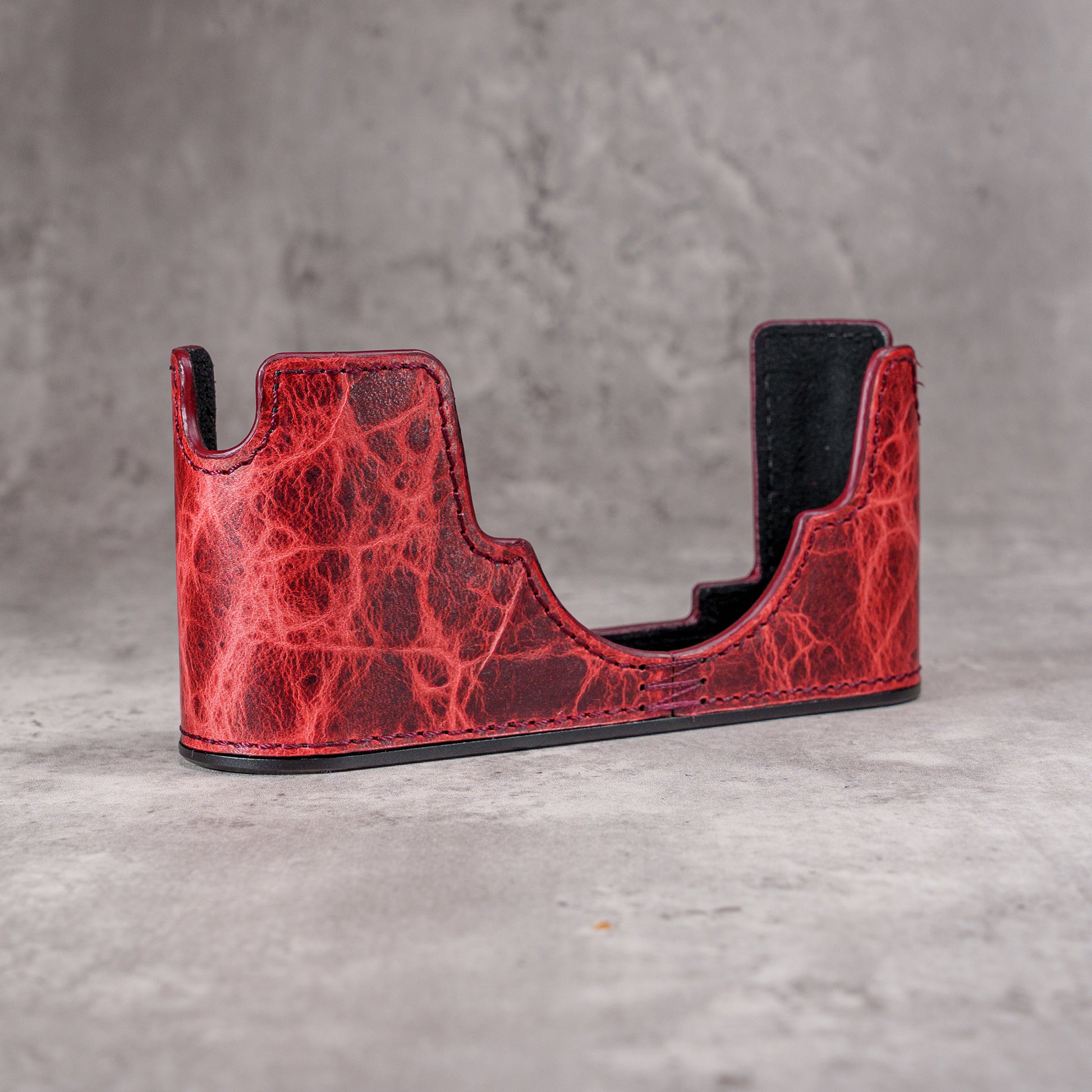 The Hot Lava SlimCase at three quarters, showing the dark veining in the red leather