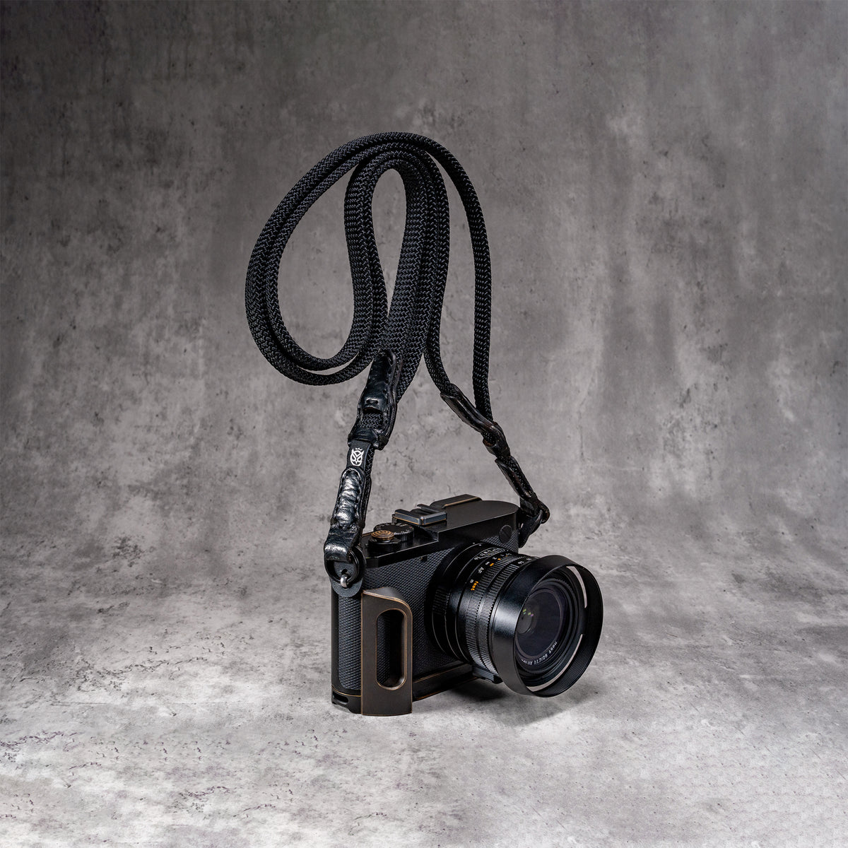 Travel Kit for Leica Q2 and Q3 in Black Patina, camera on the strap