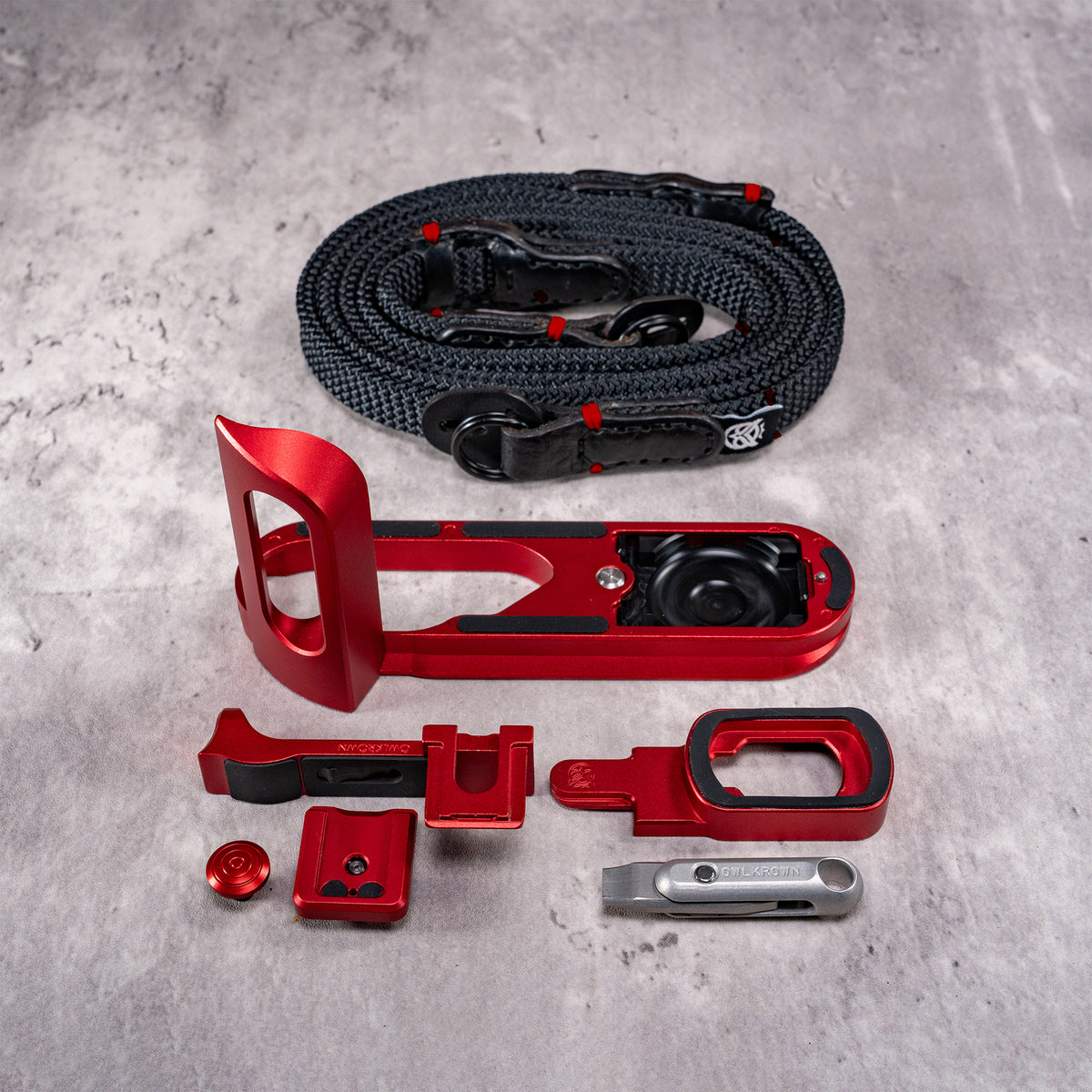 Travel Kit for Leica Q2 and Q3 in OxBlood, components laid out with the Trailflex strap
