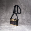 Travel Kit for Leica Q2 and Q3 in Solid Brass, camera on the strap