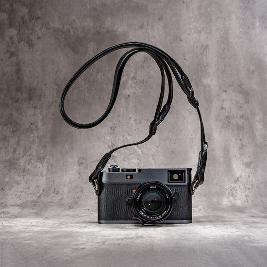 Leica M hanging from the Trailflex Leather strap in Stealth