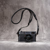 Leica M hanging from the Trailflex Leather strap in Stealth