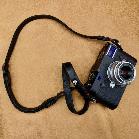 Trailflex Adjustable Leather Camera Strap in Black with Red Accent, full length, on a Leica M