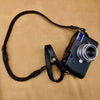 Trailflex Adjustable Leather Camera Strap in Black with Red Accent, full length, on a Leica M