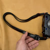 Holding the Trailflex Leather strap to show its length