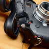 Close up of the full grain leather strap end, red stitching and split ring