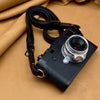 Trailflex Leather strap looped over a Leica M with a silver lens