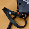 Full grain leather strap end with Owlkrown logo and red stitching