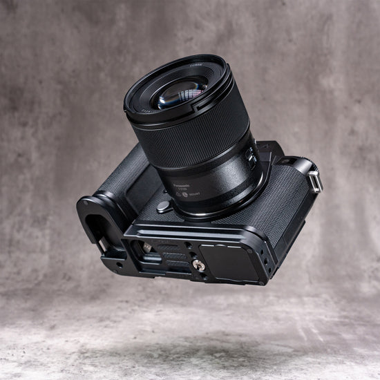 Leica SL3 and lens angled to show the Arca profile machined into the base of the Owlkrown FlexPlate