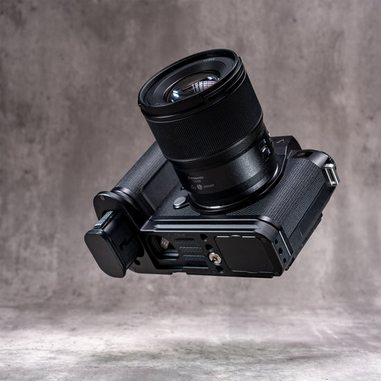 Leica SL3 with lens, low angle showing the Owlkrown FlexPlate along the base of the camera