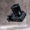 Leica SL3 with lens, low angle showing the Owlkrown FlexPlate along the base of the camera