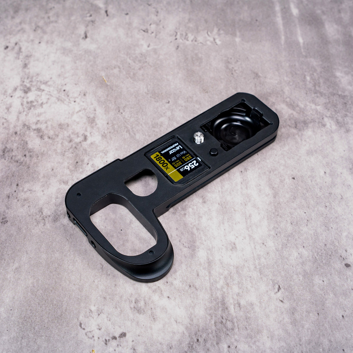 Owlkrown FlexPlate for Leica SL3 on its own, angled view with a spare SD card in the external bay