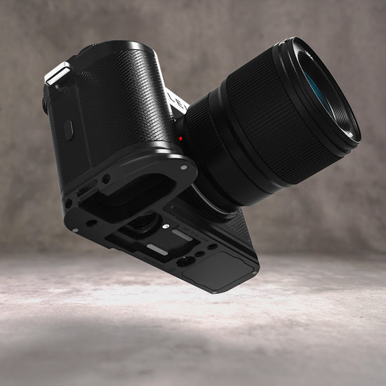Owlkrown FlexPlate for Leica SL3 in Black Chrome, camera and lens tilted to reveal the machined base plate underneath