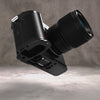 Owlkrown FlexPlate for Leica SL3 in Black Chrome, camera and lens tilted to reveal the machined base plate underneath
