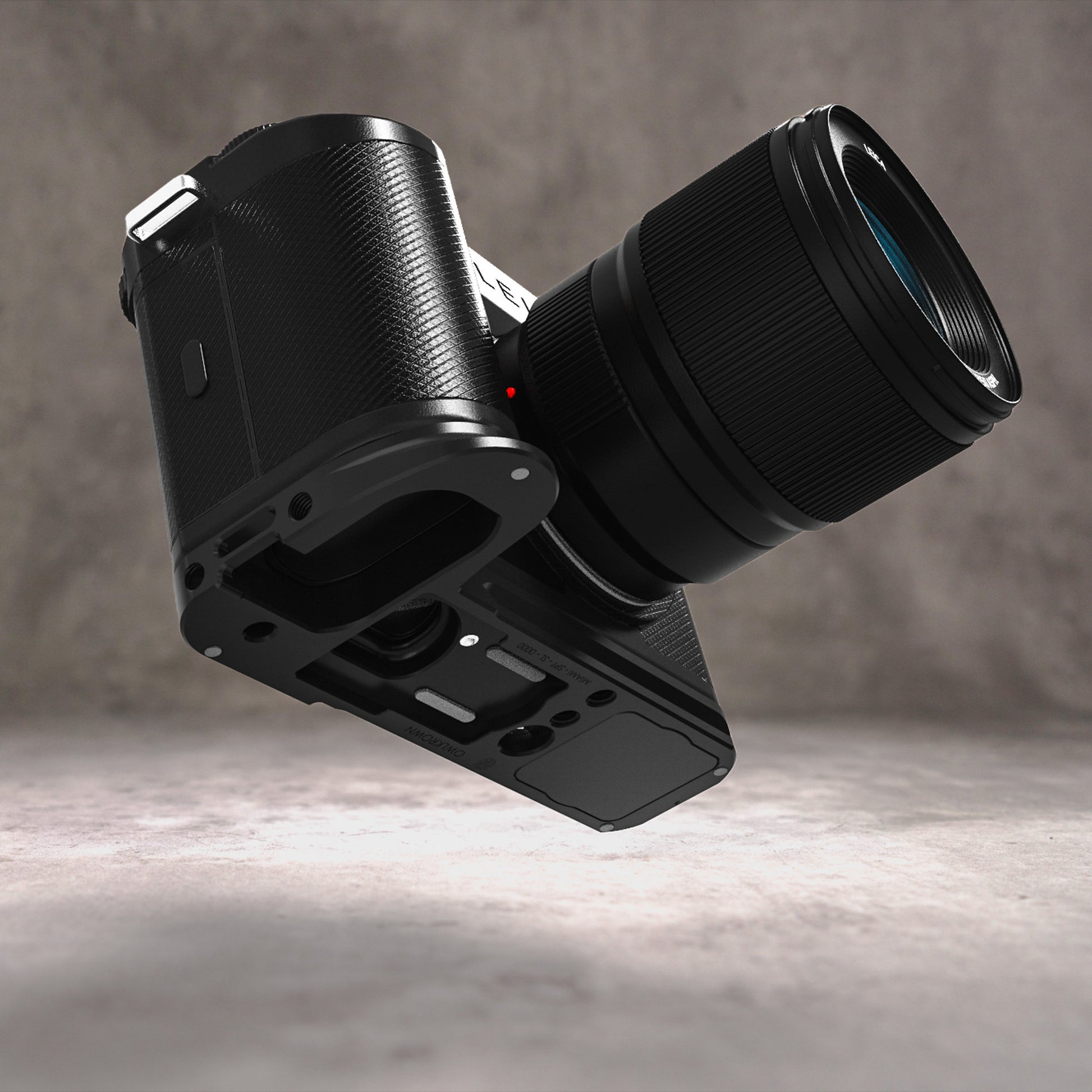 Owlkrown FlexPlate for Leica SL3 in Black Chrome, camera and lens tilted to reveal the machined base plate underneath