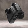 Leica SL3 tilted back to show the underside of the Owlkrown FlexPlate and its mounting points