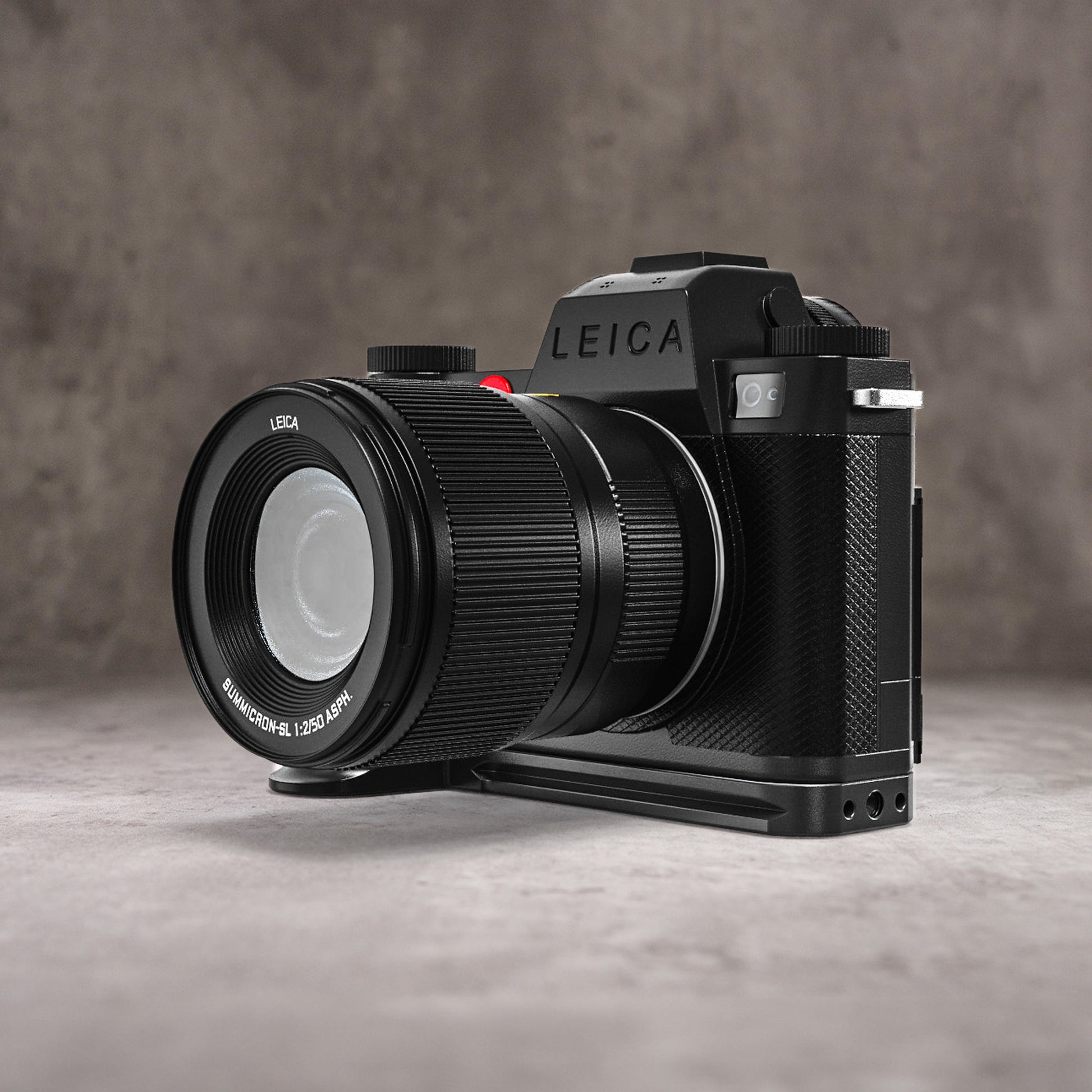 Leica SL3 and lens on the Owlkrown FlexPlate, front left view showing the extended grip