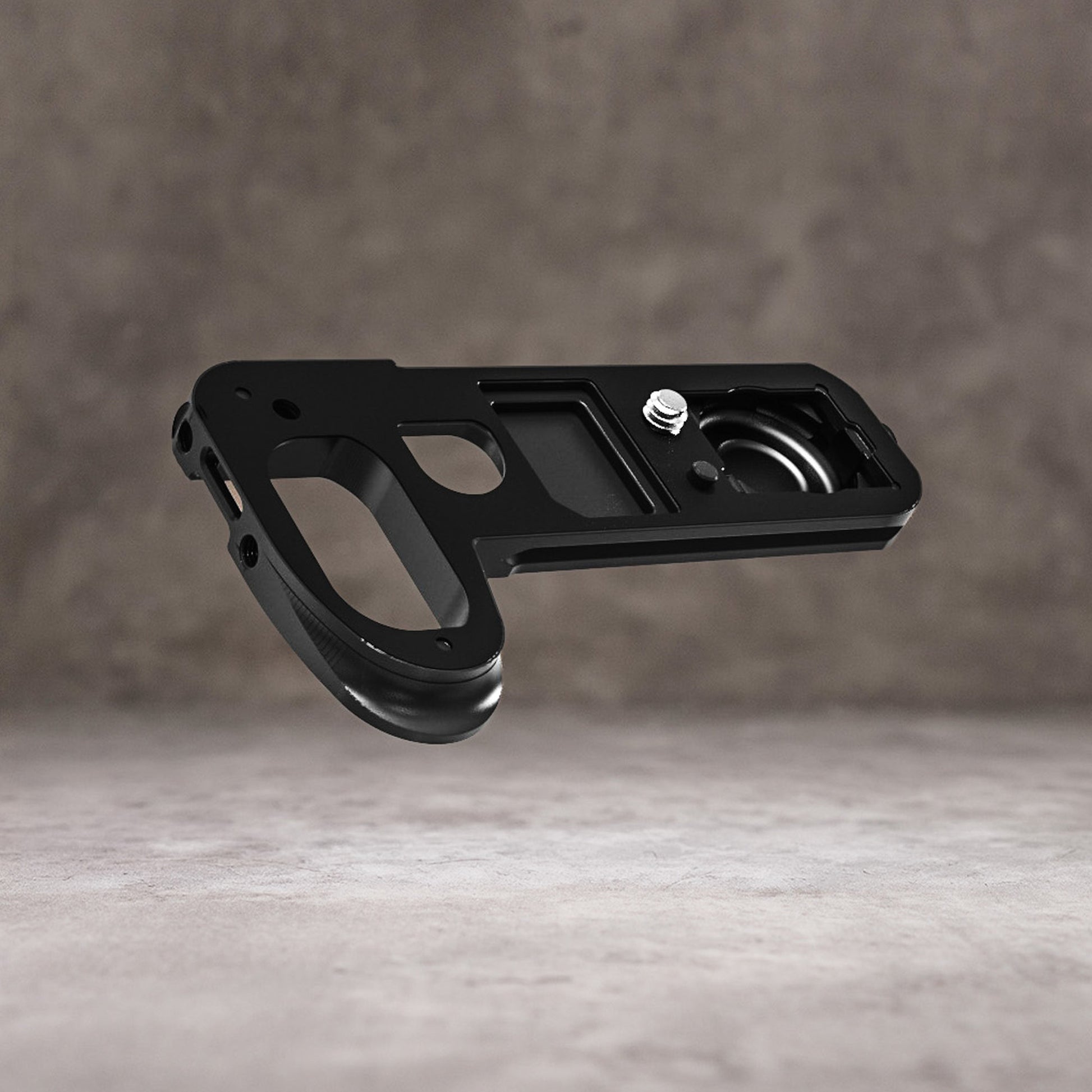 Owlkrown FlexPlate for Leica SL3 on its own, angled view showing the pinky ledge and mounting screw