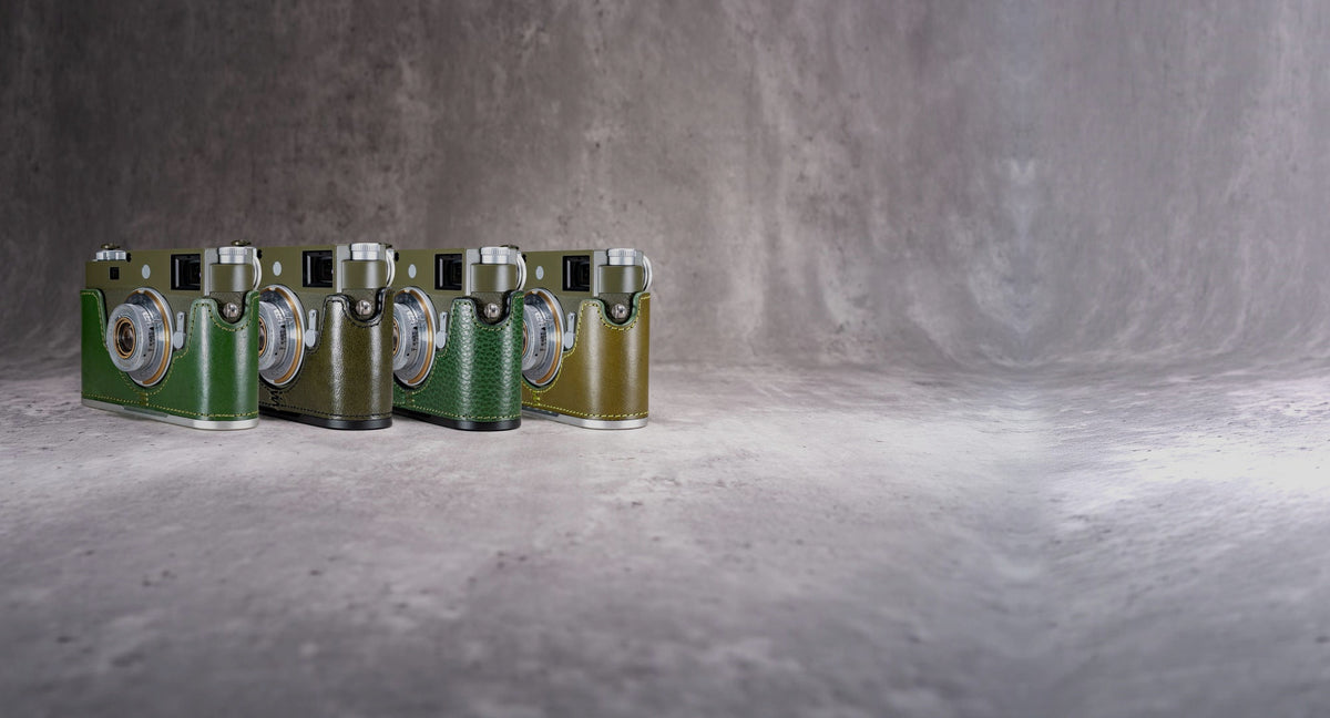 Four Leica cameras in green FlexCases: Emerald, Safari, Green Patina and Pine Green