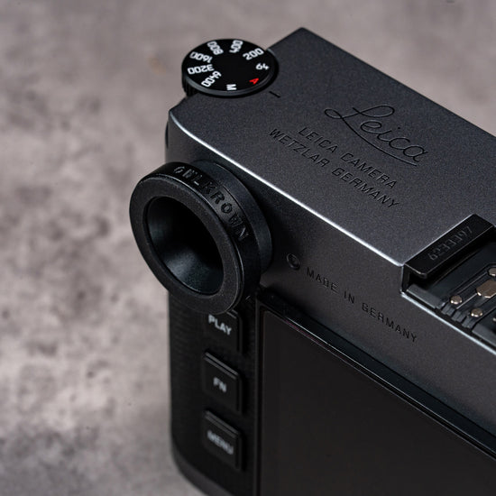 Owlkrown M-EyeKup Black Chrome on a black Leica M body, angled view from above