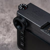 Owlkrown M-EyeKup Black Chrome on a black Leica M body, angled view from above