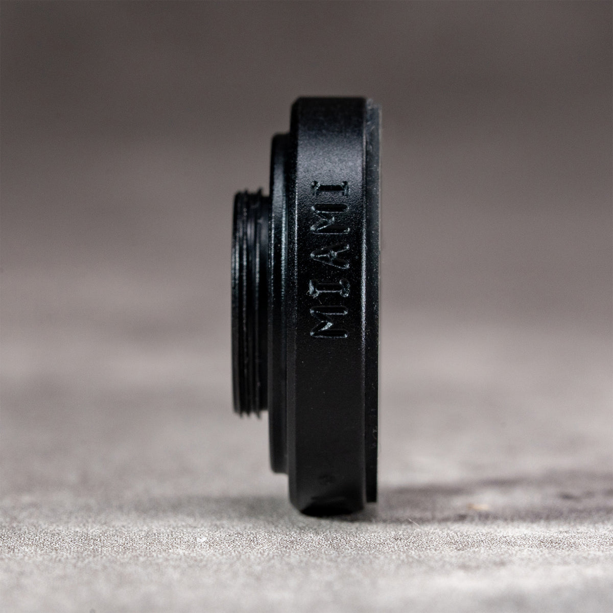 Side profile of the Owlkrown M-EyeKup in Black Chrome, machined in Miami