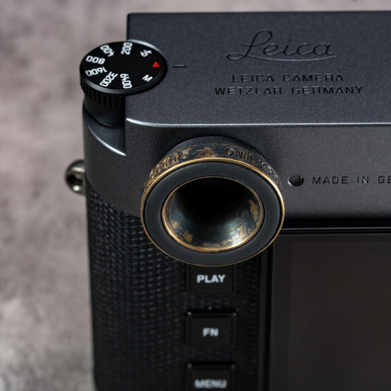 Owlkrown M-EyeKup Black Patina on a Leica M viewfinder, top plate view