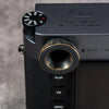 Owlkrown M-EyeKup Black Patina on a Leica M viewfinder, top plate view