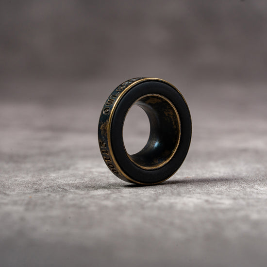 Black Patina M-EyeKup showing the aged brass body and silicone pad