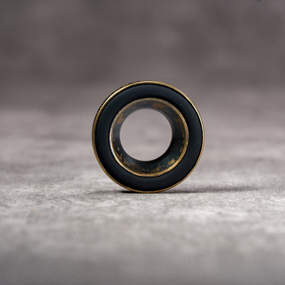 Front view of the Owlkrown M-EyeKup in Black Patina