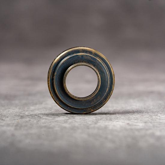 Owlkrown M-EyeKup Black Patina viewed head on, machined face detail
