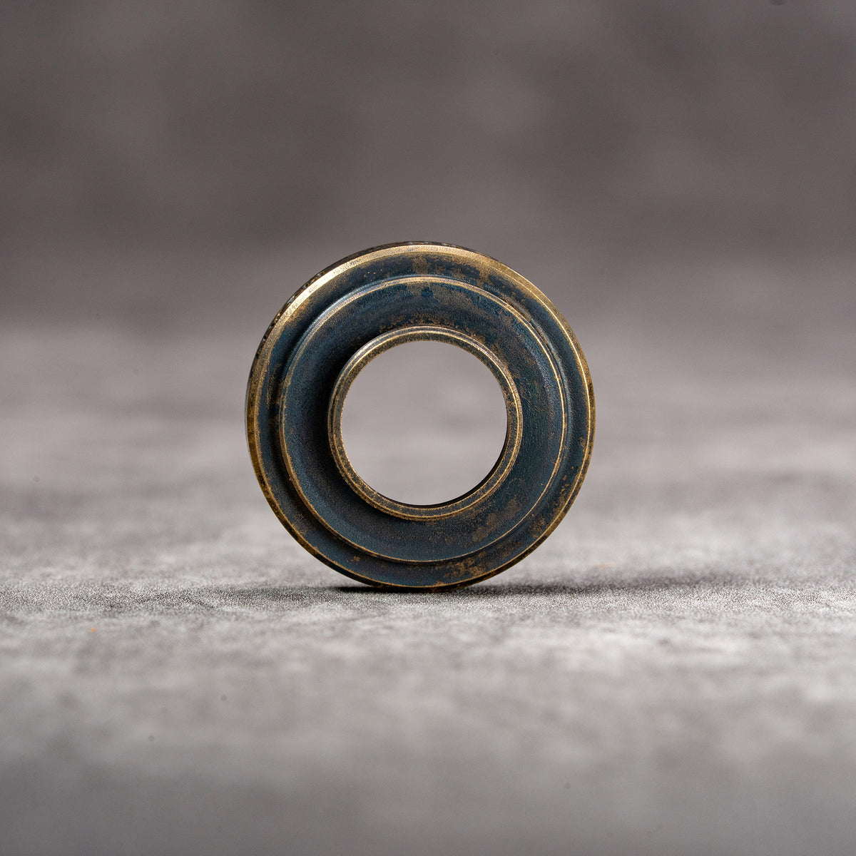 Owlkrown M-EyeKup Black Patina viewed head on, machined face detail