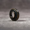 Black Patina M-EyeKup at an angle, showing the threaded barrel