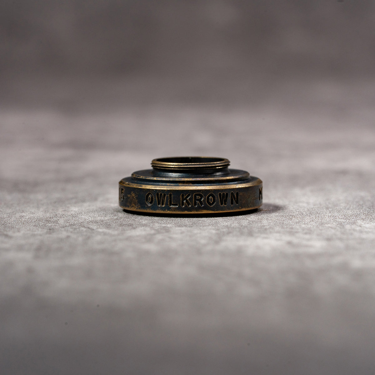 Underside of the M-EyeKup Black Patina showing the threaded barrel and Owlkrown engraving