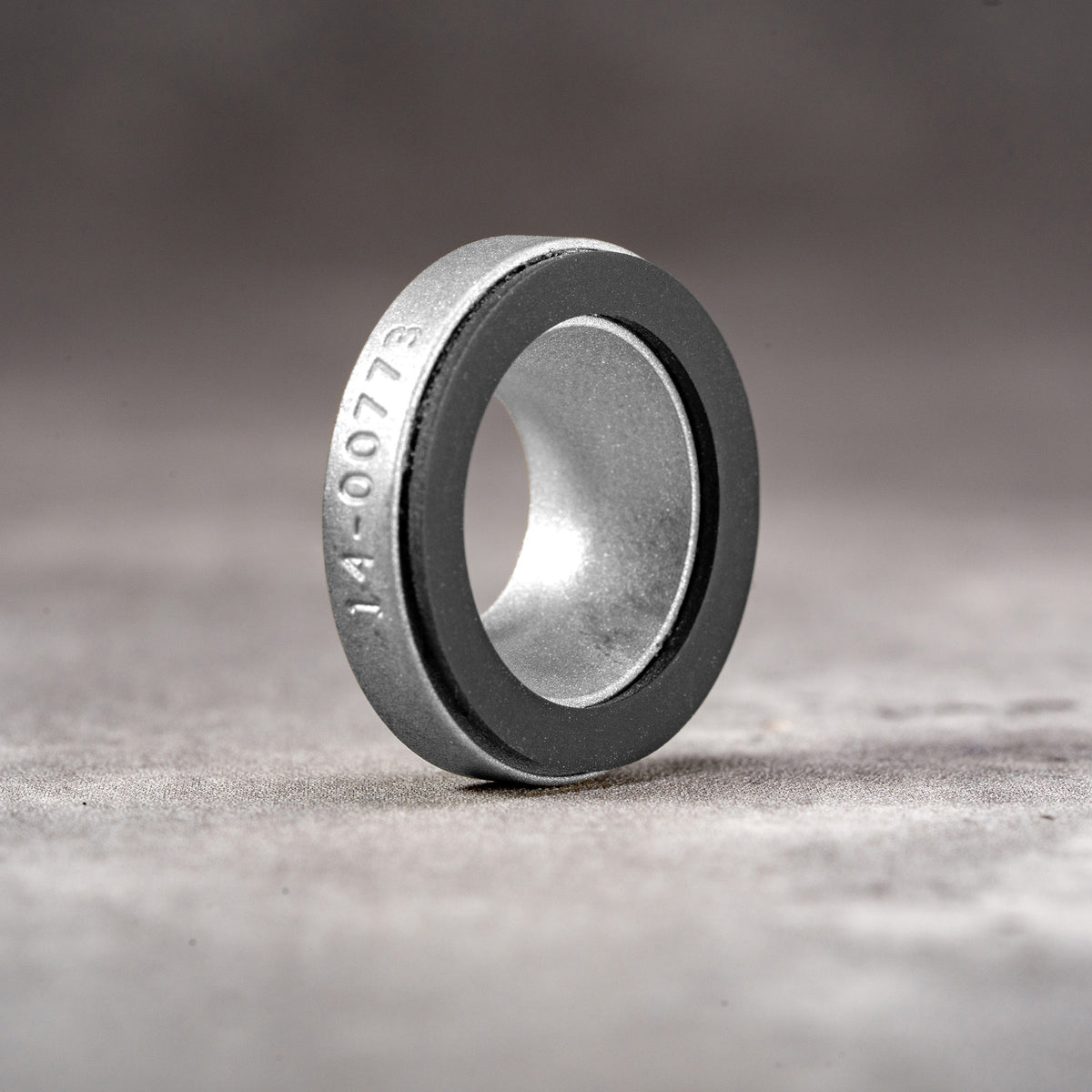 Silver Chrome M-EyeKup showing the machined aluminum body and silicone pad