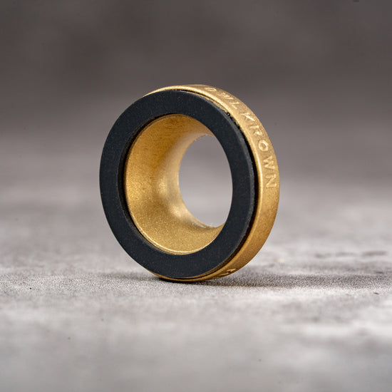 Owlkrown M-EyeKup in Solid Brass, three-quarter view showing the Owlkrown engraving