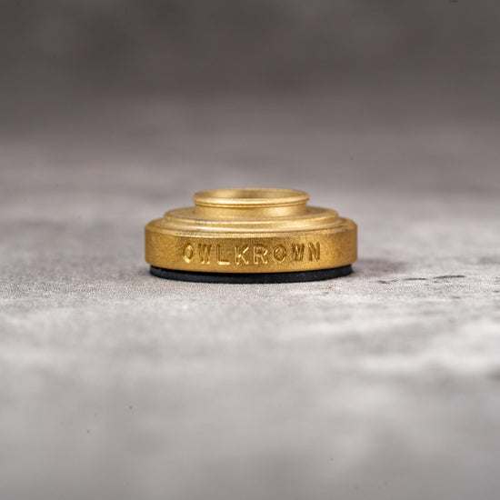 Solid Brass M-EyeKup with the Owlkrown engraving and threaded barrel visible