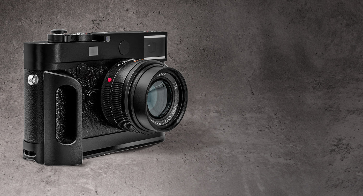 The Leica M10 with the Owlkrown FlexGrip fitted, photographed against a concrete wall