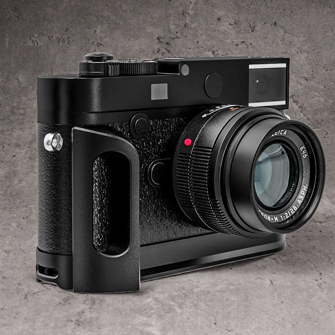 The Leica M10 with the Owlkrown FlexGrip fitted, photographed against a concrete wall