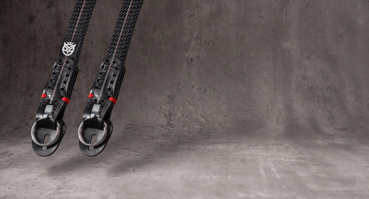 Two No Slice Steel Core straps hanging, the steel cable visible running through each